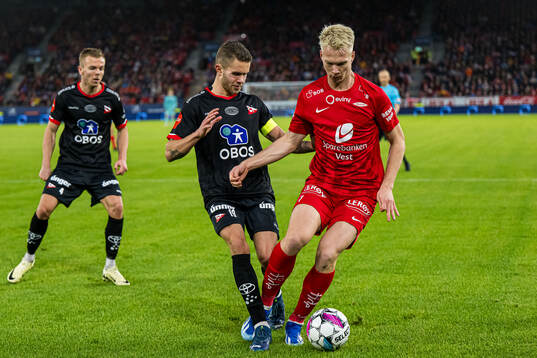 Julius Magnusson of Fredrikstad and Magnus Warming of Brann