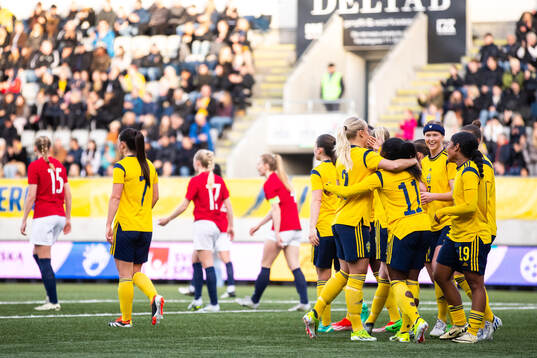 Monica Jusu Bah of Sweden celebrate with team mates