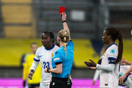 Vicki Becho of France receives a red card