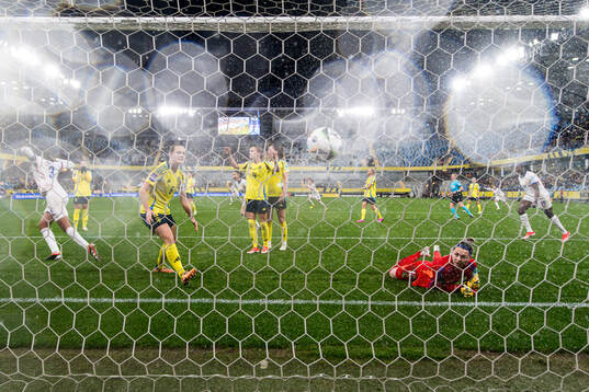 Magdalena Eriksson and goalkeeper Jennifer Falk of Sweden
