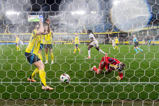 Magdalena Eriksson and goalkeeper Jennifer Falk of Sweden