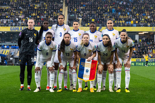 Players of France pose for a team group photo