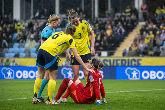 Goalkeeper Jennifer Falk of Sweden in pain
