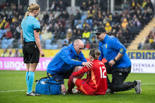 Goalkeeper Jennifer Falk of Sweden in pain