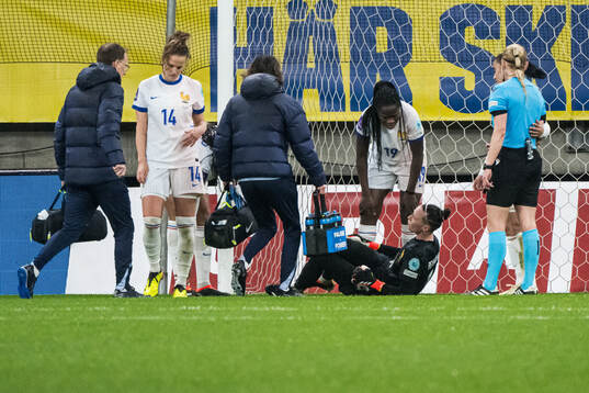 goalkeeper Pauline Peyraud-Magnin of France in pain