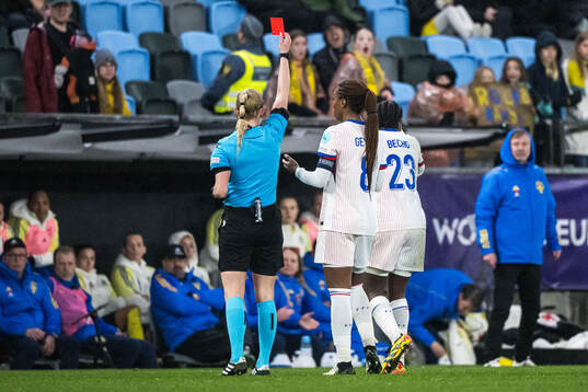 Vicki Becho of France receives a red card