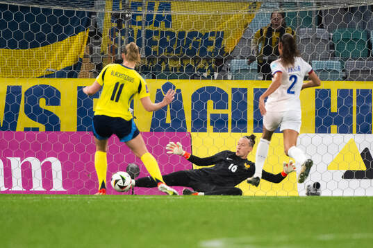 Stina Blackstenius of Sweden and goalkeeper Pauline