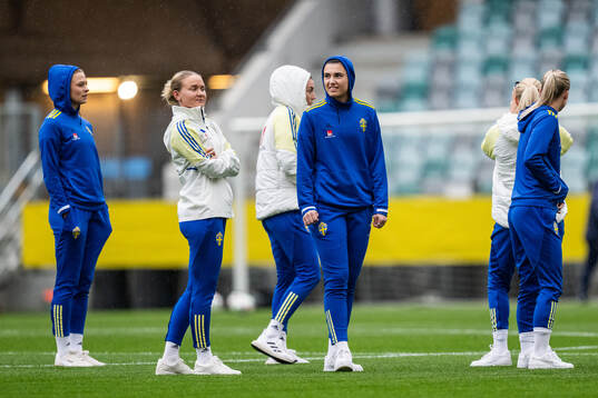 Matilda Vinberg and goalkeeper Zecira Musovic of Sweden