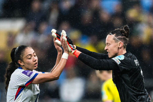 Sandie Toletti and goalkeeper Pauline Peyraud-Magnin of