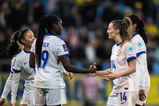Griedge Mbock Bathy and Sandie Toletti of France celebrating