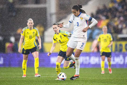 Kosovare Asllani of Sweden and Wendie Renard of France