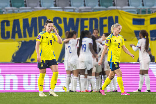 Johanna Rytting Kaneryd and Jonna Andersson of Sweden looks
