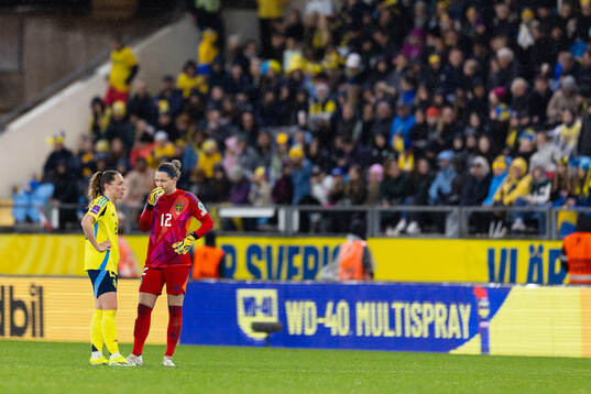 Elin Rubensson and goalkeeper Jennifer Falk of Sweden