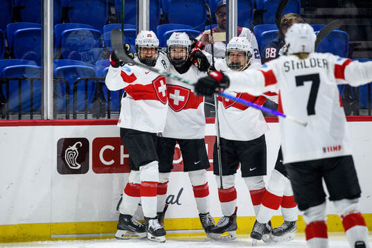 Ivana Wey of Switzerland celebrates with teammates