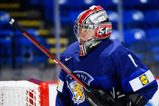 Goaltender Sanni Ahola of Finland looks dejected