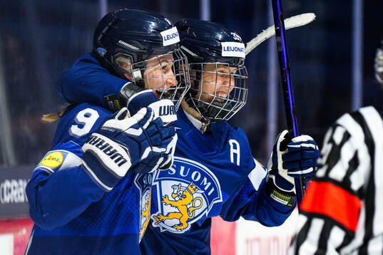 Nelli Laitinen of Finland celebrates with Michelle Karvinen