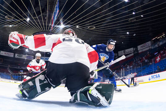 Goaltender Andrea Brändli of Switzerland and Nelli