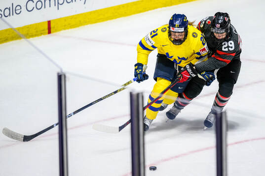 Lova Blom of Sweden and Marie-Philip Poulin of Canada