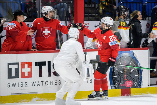 Alina Muller of Switzerland celebrates scoring 1-0