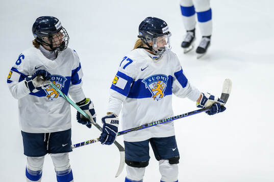 Petra Nieminen and Susanna Tapani of Finland look dejected