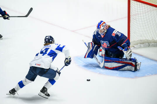 Viivi Vainikka of Finland and goaltender Aerin Frankel of