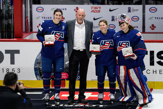 Megan Keller, Kendall Coyne Schofield and goaltender Aerin