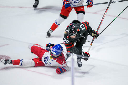 Aneta Tejralova of Czech Republic and Marie-Philip Poulin
