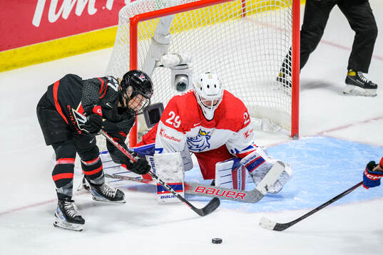 Emma Maltais of Canada and goaltender Klara Peslarova of