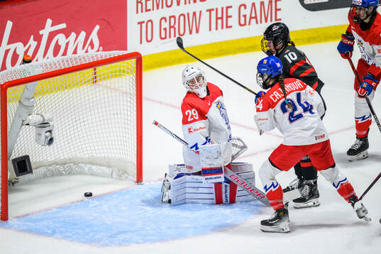 Sarah Fillier of Canada scores 5-0 behind goaltender Klara