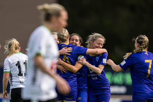 Julie Belden Rasmussen of Fyllingsdalen celebrates