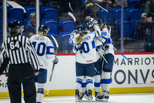 Viivi Vainikka of Finland celebrates with teammates