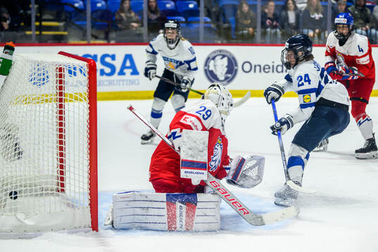Viivi Vainikka of Finland scores 1-2 behind goaltender