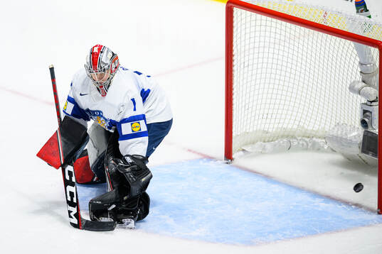 Denisa Krizova of Czech Republic (not in picture)  scores