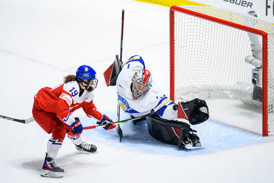 Natalie Mlynkova of Czech Republic and goaltender Sanni