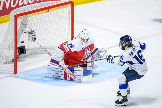 Petra Nieminen of Finland scores behind goaltender Klara