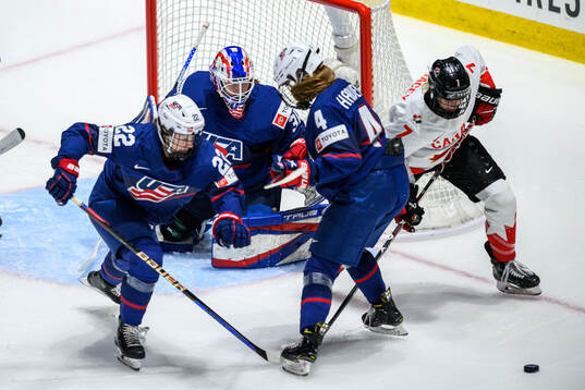 Tessa Janecke, goaltender Aerin Frankel and Caroline Harvey