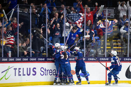 Megan Keller of USA celebrates with teammates
