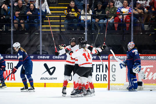 Emily Clark of Canada celebrates scoring 4-4