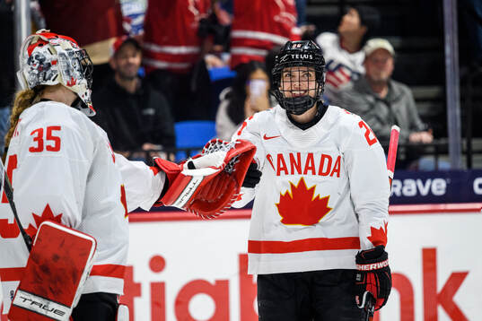 Emily Clark of Canada celebrates scoring 4-4