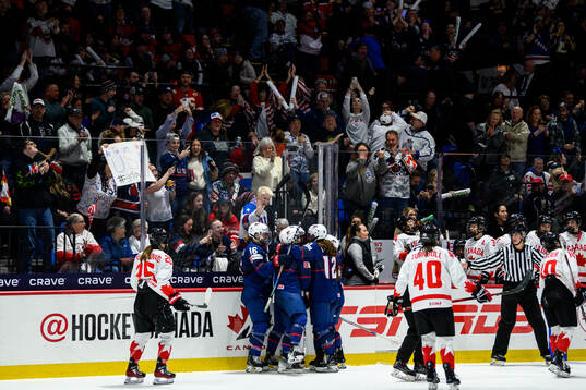 Caroline Harvey of USA (not in picture) celebrates scoring