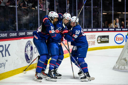 Hilary Knight of USA celebrates with teammates
