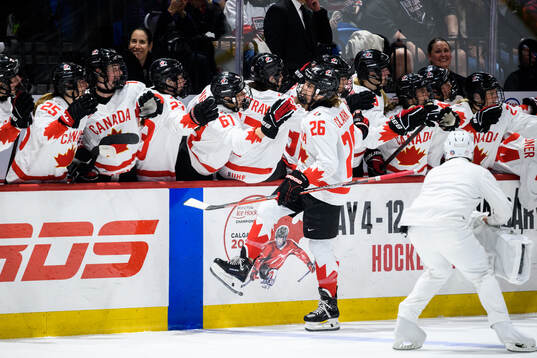 Emily Clark of Canada celebrates scoring 4-4