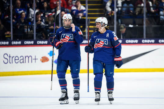 Hilary Knight and Alex Carpenter of USA look dejected