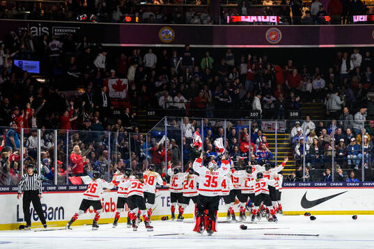 Danielle Serdachny of Canada (not in picture) celebrates