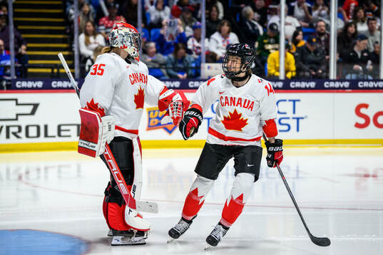 Goaltender Ann-Renee Desbiens and Renata Fast of Canada
