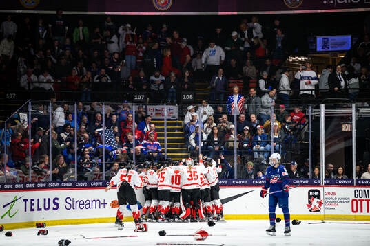 Danielle Serdachny of Canada (not in picture) celebrates