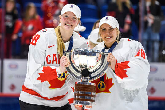 Julia Gosling and goaltender Emerance Maschmeyer of Canada