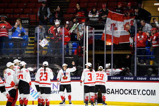 Players of Canada leave the ice