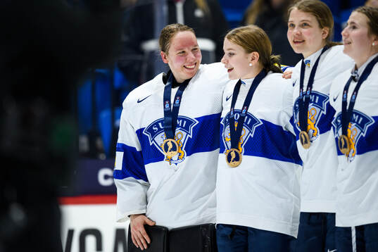 Goaltender Sanni Ahola of Finland celebrates