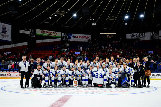 Players and staff of Finland celebrate